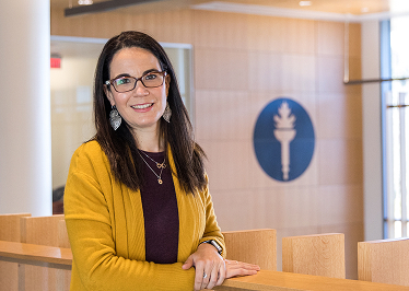 Woman in a standing in the Rowan lobby.